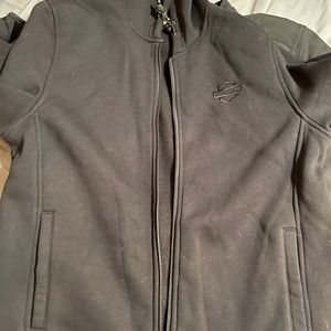Men’s medium Harley jacket.  Vents and adjustable waist and armsHooded liner.